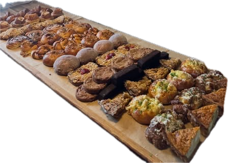 Pastries and bread laid out along the old bar at Joyce's
