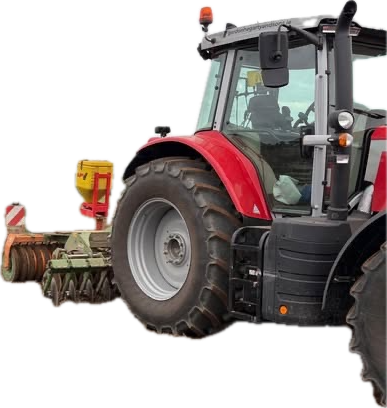 A red tractor drilling seed into a brown Carlow field